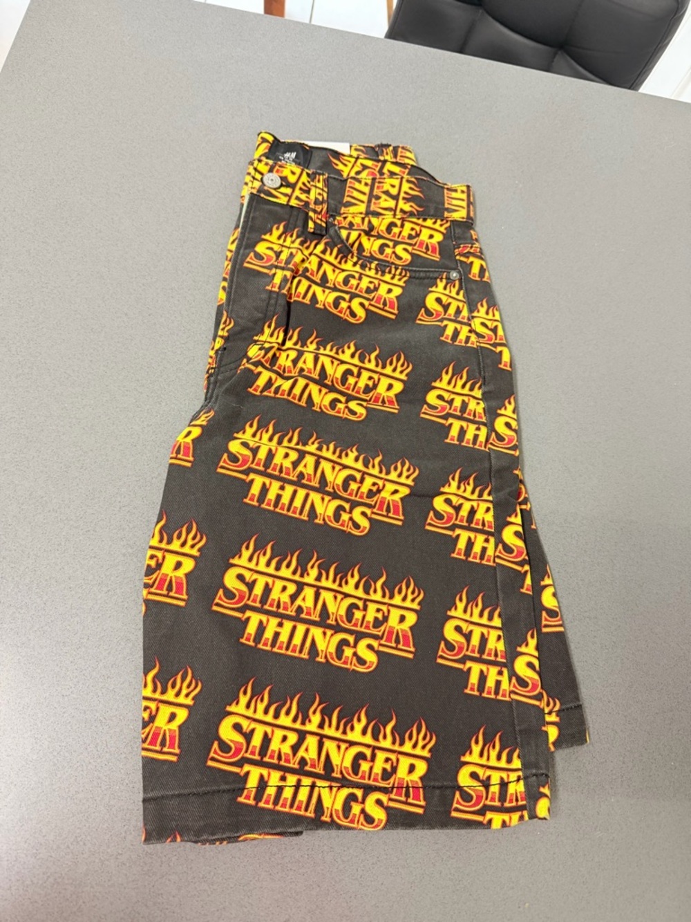 Summer H&M Black denim  Shorts with Yellow & Orange  'Stranger Things' Print